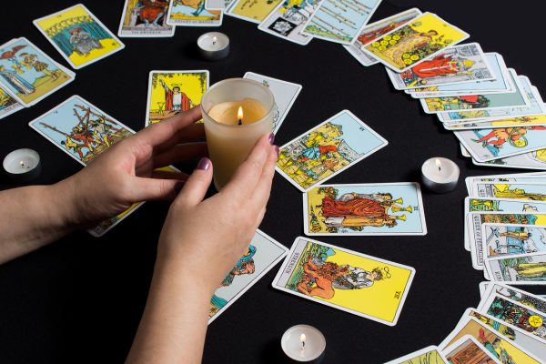Bangkok,Thailand,november.22.19. Gypsy lays out Tarot cards and wonders for the future. Christmas fortune telling and fortune telling. Magical sessions with the cards. Women's hands and Tarot cards.